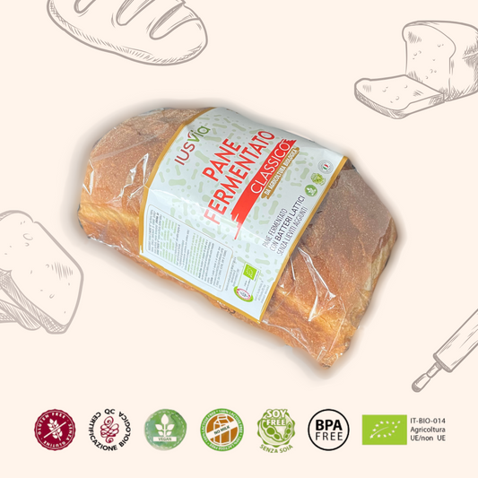 Foto prodotto Pane Fermentato Classico da Agricoltura Biologica. Sullo sfondo ci sono delle illustrazione di pane, pane a fette, fette di pane e mattarello. Inoltre vediamo riportati i loghi, Gluten Free, Certificazione Biologica, Senza Latte, Vegano, Soy Free, BPA Free, IT-BIO-014 Agricoltura UE/non UE.